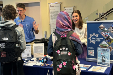 Representatives from SEK speak with students at a recent Accounting Expo