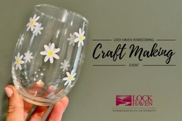 Hand hold a wine glass for the Lock Haven Craft Making event