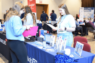 A recruiter from WebFX reviews a resume from a Communication Studies senior.