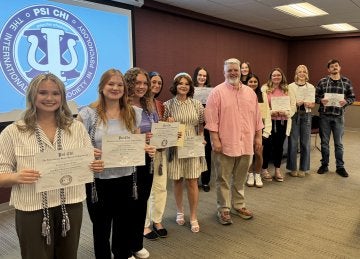 Shown, from left, are Psi Chi inductees Madeline O'Neil, Alyssa Weigle, Jaelyn Bradley, Faith Persing, Abagail Butler, Madison Tolomay, Dr. Scott Carnicom, Riley Wharton, Salma Villamorales, Madelyn Crawford-Randow, Payton McCully and Emmett O'Neill. Not pictured: Tyler Clawson, Aaron Eldred, Adia Grinnell, Kaylee Hart, Evie Rembold, Jace Szaflarski and Allison Weaver.