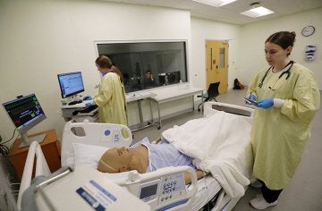 Students work on nursing skills in CU's simulated learning lab