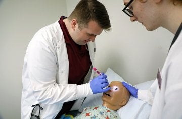 Students work on nursing skills in CU's simulated learning lab