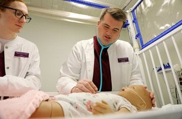 Students work on nursing skills in CU's simulated learning lab