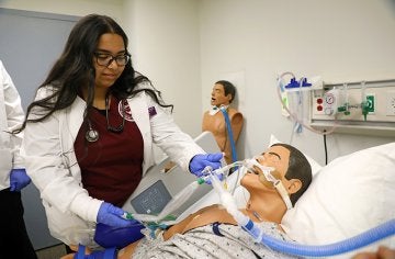 Students work on nursing skills in CU's simulated learning lab