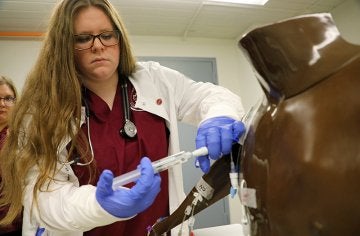 Students work on nursing skills in CU's simulated learning lab