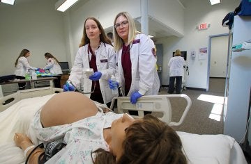 Students work on nursing skills in CU's simulated learning lab