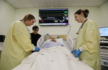 Students work on nursing skills in CU's simulated learning lab