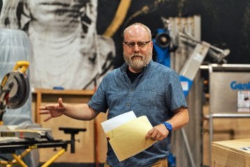 Professor David Miller directing a play.