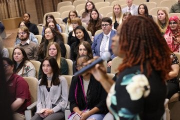 Frederick Douglass scholars in audience during induction ceremony with speaker Dr. Carolyn Reid-Brown