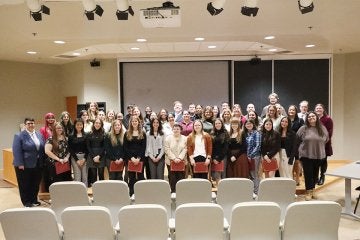 Frederick Douglass Scholars pose for a group photo after the induction ceremony in 2025.