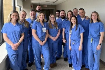 A group of Nurse Anesthetists standing together posing for a photo.