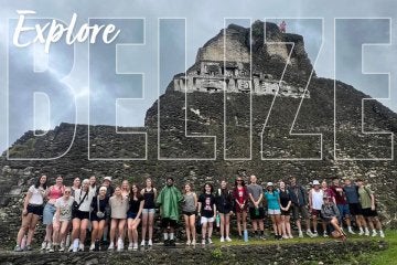 A group of students from Commonwealth University pose in front of El Castillo in Belize.