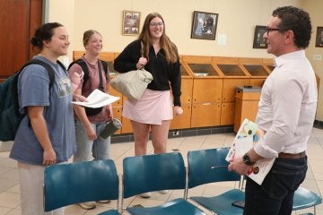 CU President Jeff Osgood talking with students.