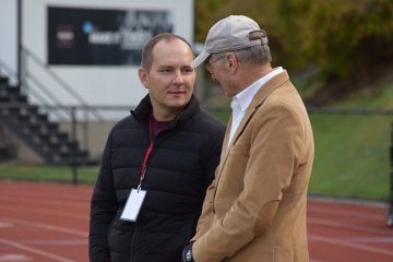 Mansfield Athletic Director Andrew Petko speaks with Steve McCloskey during an athletic event at Van Norman Field