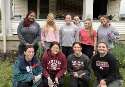 Commonwealth University-Lock Haven, formerly Lock Haven University, students outside of the historic Honors House