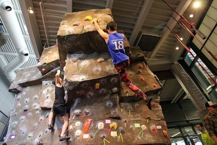 Quest students rock climbing indoors.