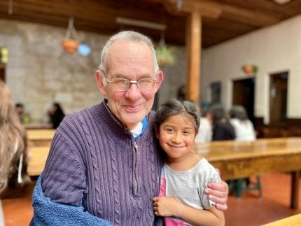 Granich with a student at Education and Hope