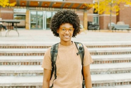 Bloomsburg student standing near the Student Services Center