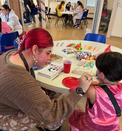 Social Work student works Salvation Army After School Easter Party