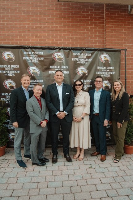 Shown, from left, are Erik Evans, vice president for advancement; Matt Heydt, LHUF relationship manager; Nick Subich and his wife Gina; Jeff Osgood, CU president; and Ashley Koser, LHUF executive director at the formal gift announcement outside of Bentley Hall on Friday, May 15.
