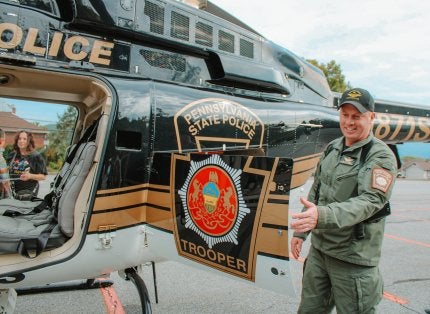 PSP helicopter pilot Cpl. Kyle Schaad showing parts of the helicopter to attendees of his presentation.