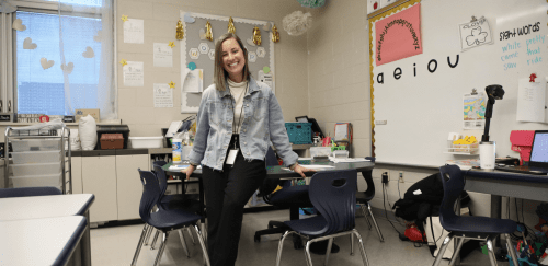 teacher smiling in classroom