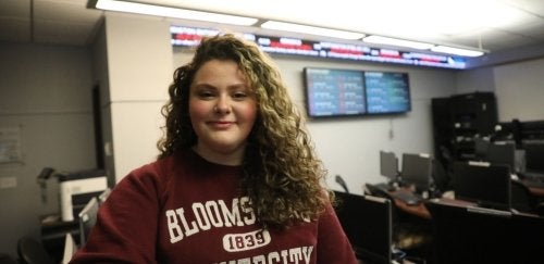 Finance student getting their picture taken in a Sutliff computer lab