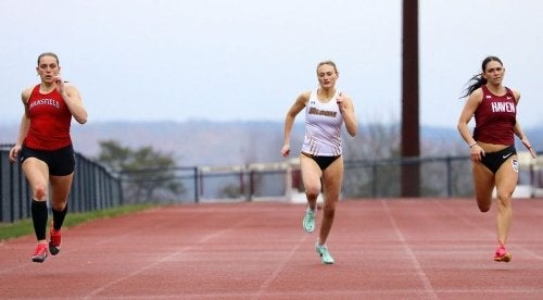 Runners compete in the 800 meter dash at a triad track and field meet at Commonwealth University-Bloomsburg, formerly Bloomsburg University.