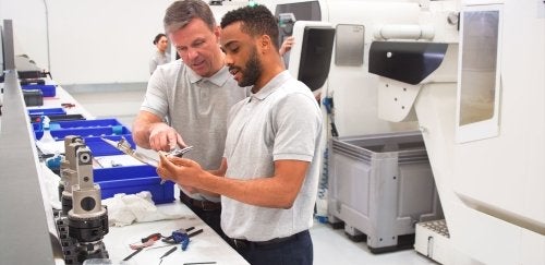 Engineers looking at components