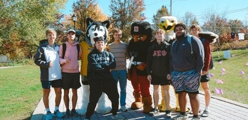 A group of students at Lock Haven are posing with the CU mascots