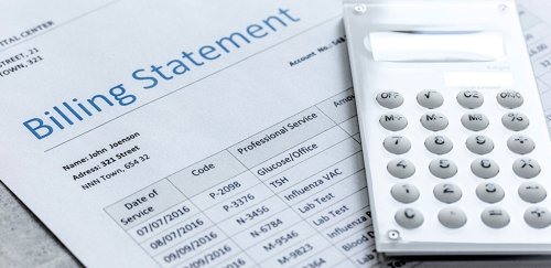Medical billing statement with a calculator.
