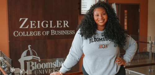M.S. Instructional Design and Technology student standing in Sutliff Hall