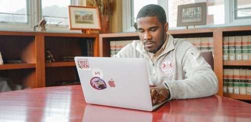 Justin White using laptop.