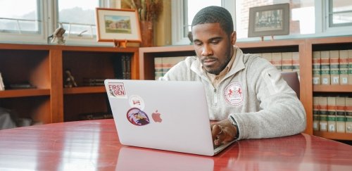 Justin White using laptop.