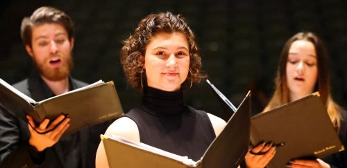 music choral students singing on stage