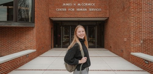 MSW student standing in front of McCormick Hall