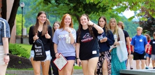 Students walk through Commonwealth University Mansfield on a campus tour