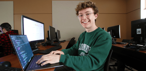 Bloomsburg Computer Science student working on a lap top