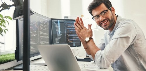 A man looking at a laptop