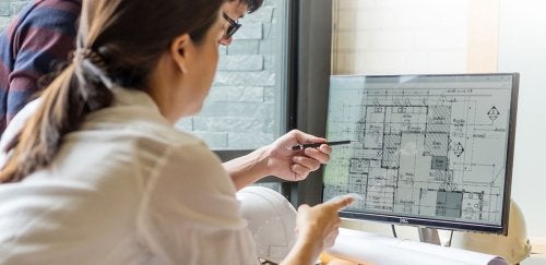 Woman using a computer for AutoCAD