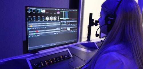 Female student working in video production setting