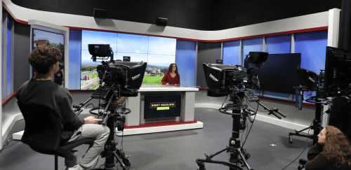 Media and journalism students on a TV set