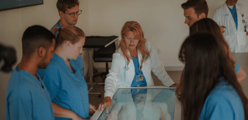 DNP Nurse Anesthesia students working on the Anatomage table