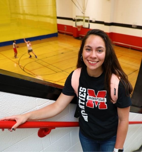 Commonwealth University-Mansfield, formerly Mansfield University of Pennsylvania, student at Kelchner Fitness Center on campus with basketball court in background