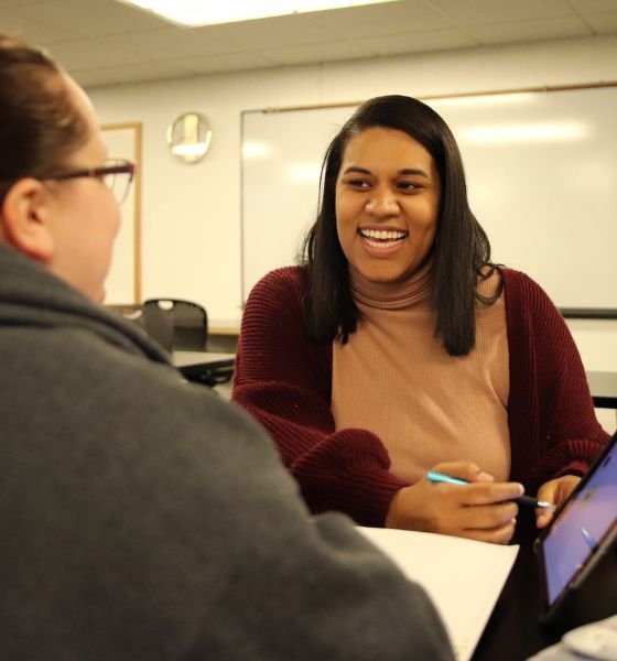 Commonwealth University students tutoring in academic advising center