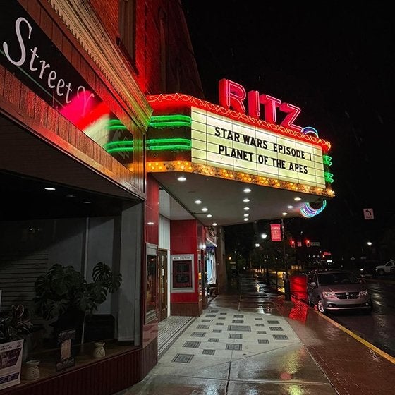 Ritz Theater lit up at night in downtown Clearfield. 