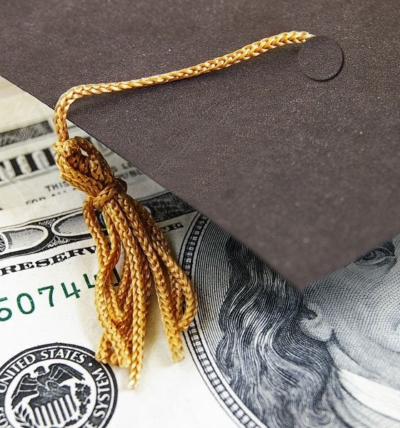 Graduation cap with money.