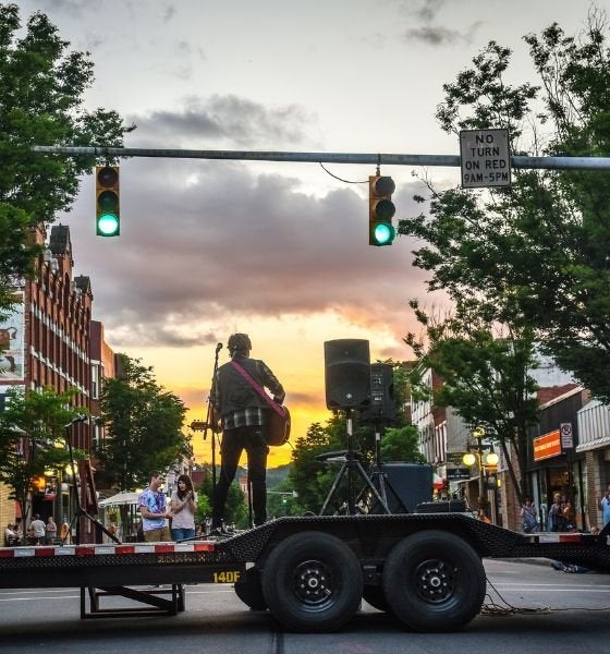 Artist performs to a crowd in downtown lock haven