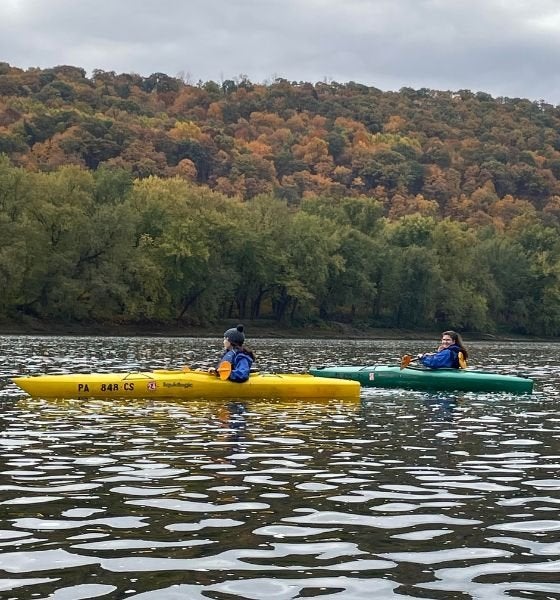 Two kayakers on a river