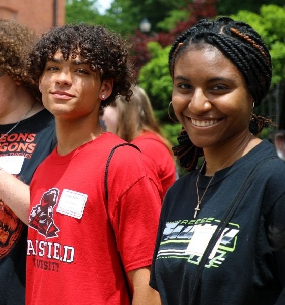 two Mansfield students smile at the camera